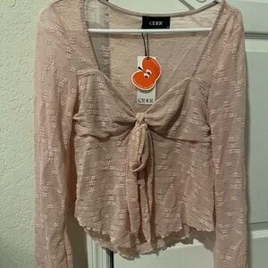 Pink long sleeve from Cider. Wasn’t the right size. ⚠️VERY SEE THROUGH⚠️